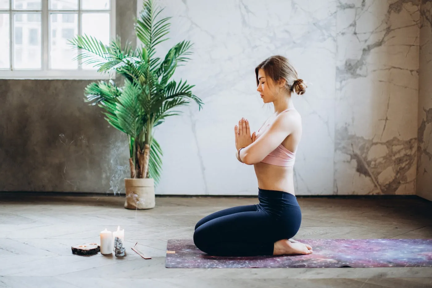 Peaceful meditation practice with candles and incense